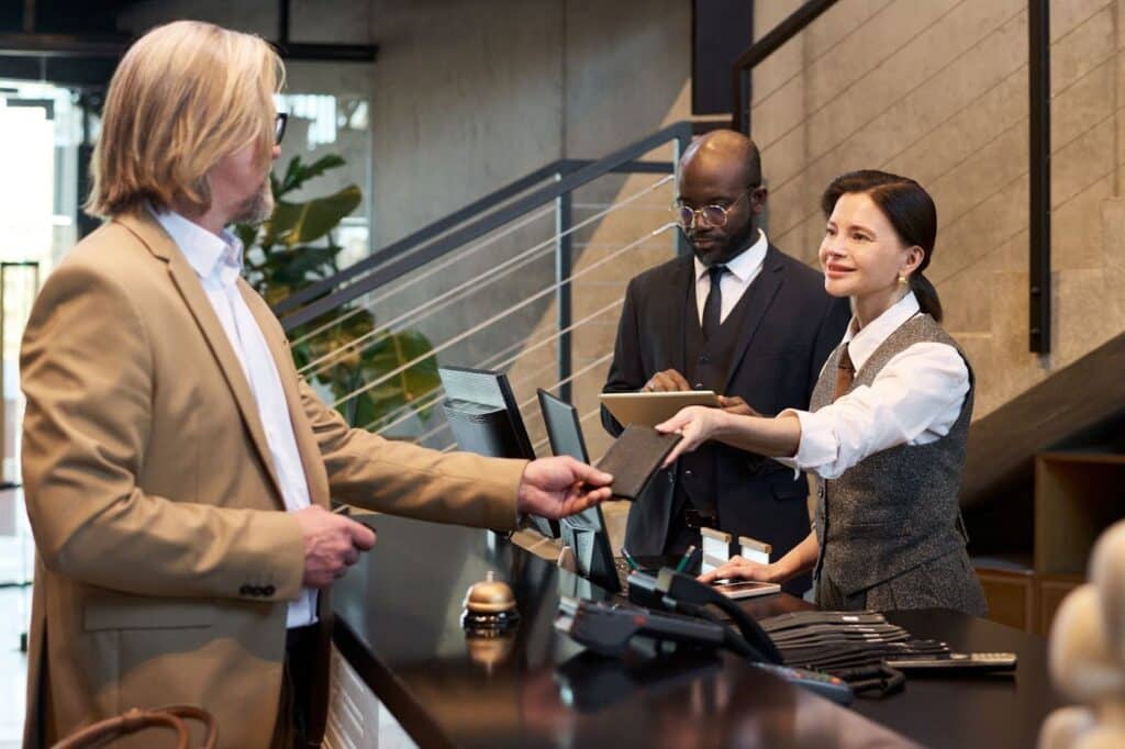 Conducting business meeting at modern office reception