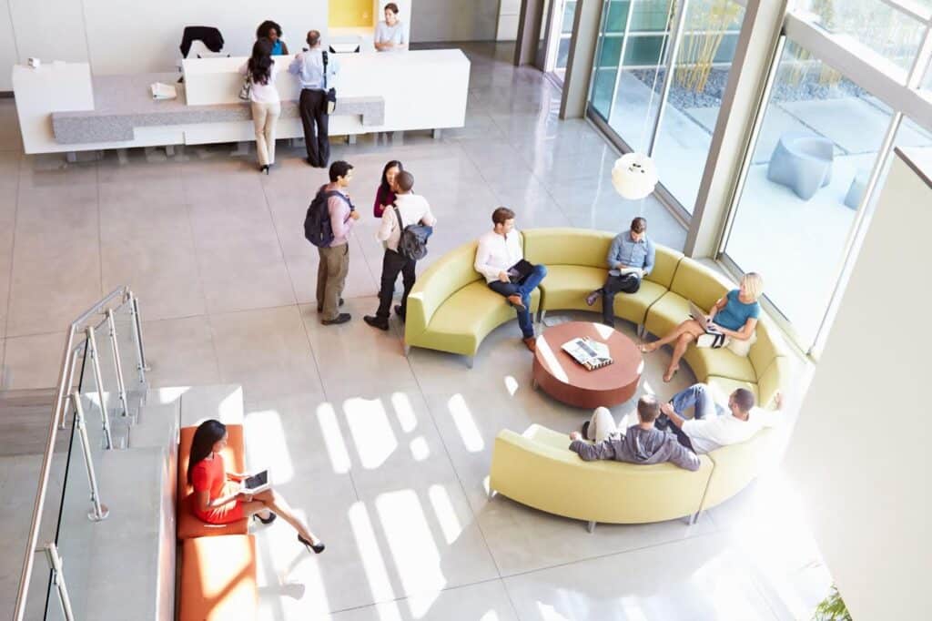 Reception area of modern office building with people